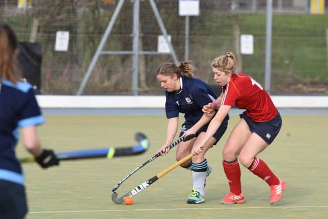 Action from City of Peterborough Ladies (red) v Colchester in East Division One North.