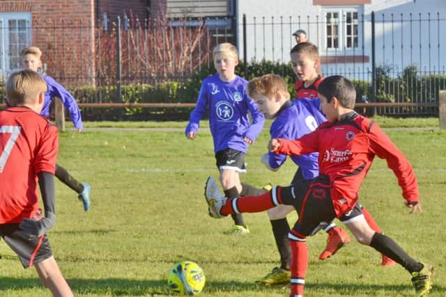 Youngsters enjoying their football at the Grange.