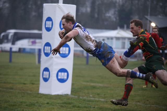 Adrian Enwright scores a try for the Lions against Sandbach. Picture: Mick Sutterby