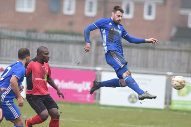 Josh Moreman of Peterborough Sports flies through the air during a 2-1 win over Sileby at PSL. Photo; David Lowndes.
