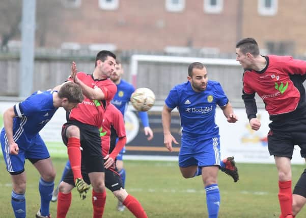Action from Peterborough Sports (blue) against Sileby in the United Counties Premier Division. Photo: David Lowndes.