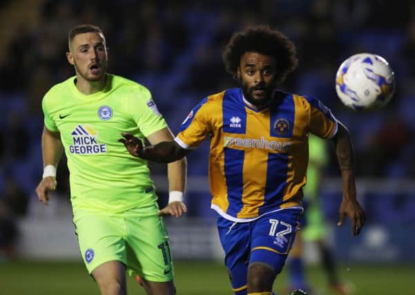 Marcus Maddison in action for Posh against Shrewsbury earlier this season.