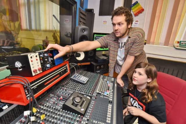 Young singer  Chloe Lorentzen (11) recording  her song at  Beat This, Norfolk Street.  She is pictured with  music director Benny Turner. EMN-171202-205407009
