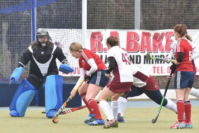 Action from City of Peterborough Ladies' (red) English Hockey Trophy win over Milton Keynes. Photo: David Lowndes.