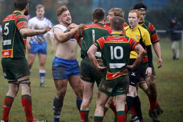 Sandbach players get shirty with Lions centre Will Carrington. Picture: Mick Sutterby