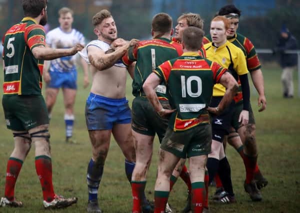 Sandbach players get shirty with Lions centre Will Carrington. Picture: Mick Sutterby