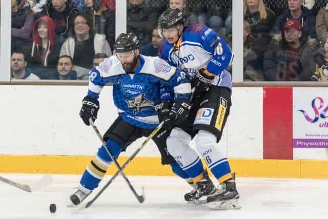 Tom Stubley fends off an MK attack by former Phantom Milan Baranyk. Picture: Tom Scott