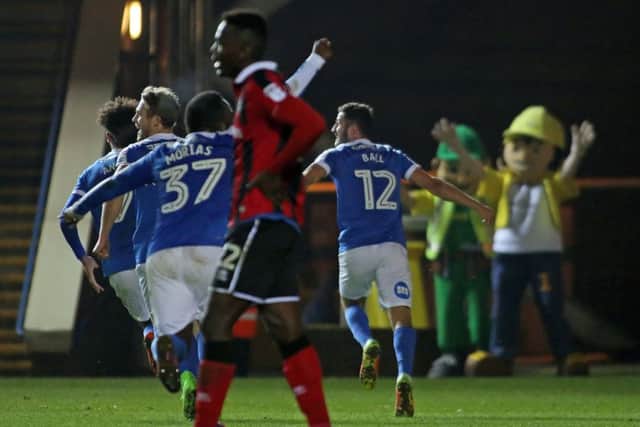 Dominic Ball (12) runs off in celebration after scoring the winning goal for Posh against Shrewsbury. Photo: Joe Dent/theposh.com.