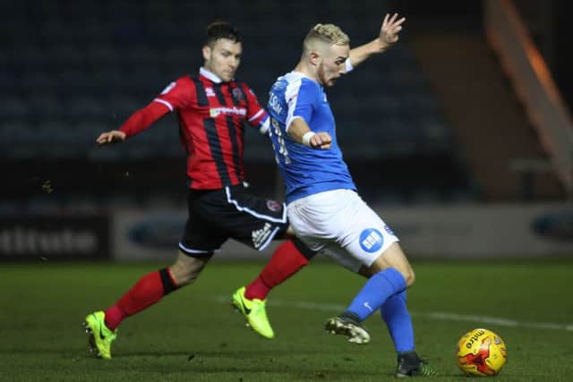 Marcus Maddison in action for Posh against Shrewsbury.