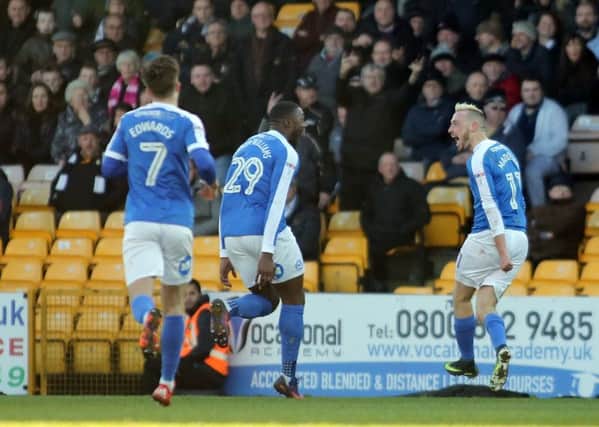 Marcus Maddison (right) celebrates a goal for Posh at Port Vale.