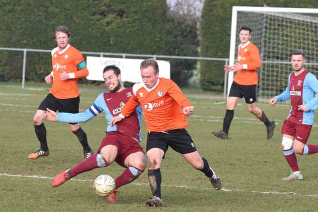 It was a disappointing 0-0 draw between Deeping (claret) and Yaxley in the United Counties Premier Division today. Photo: David Lowndes.