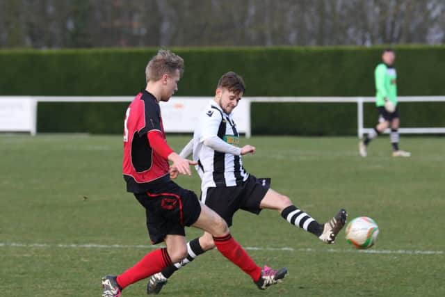 Dan Wilson (white) in action for Peterborough Northern Star in their 2-1 defeat at Sileby. Photo: Tim Gates.