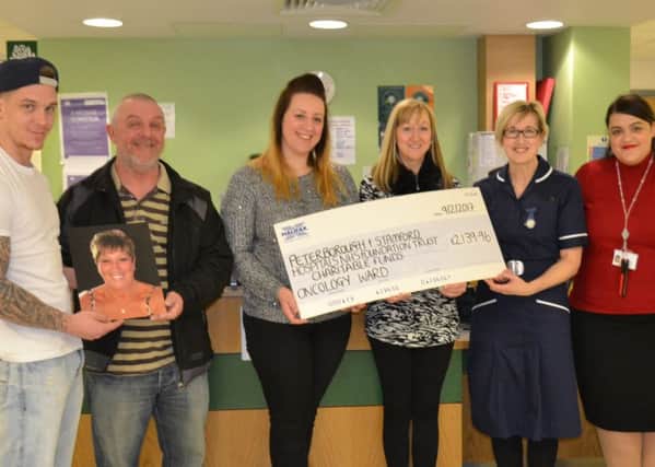 Ward manager Mandy Gray and Dr Lynn Tyers receive the donation from Sally Hefferon, with Debs husband Chris and her children Krystal and Scott.