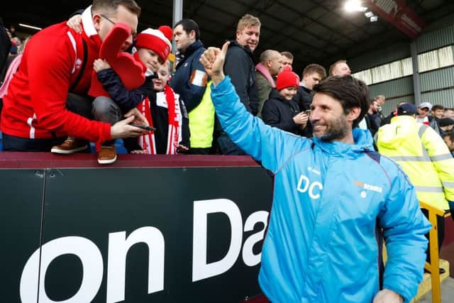 Proud Lincoln manager Danny Cowley and Imps fans at Turf Moor.