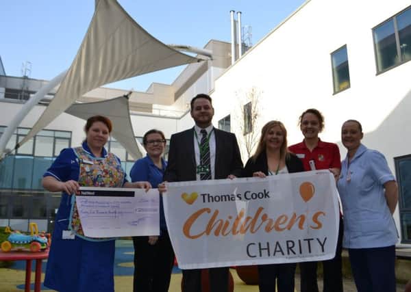 Left to right, Emma Wilson-Jones, Deputy Sister, Zoe Wilkinson, Play Specialist Co-ordinator, Anthony Groom and Theresa Monson from Thomas Cook and Stacey Slater, Play Specialist and Rachel Brown, Health Care Assistant.