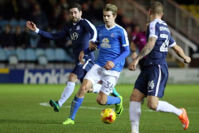 Posh midfielder Martin Samuelsen is tracked by Southend's Michael Timlin. Photo: Joe Dent/theposh.com.