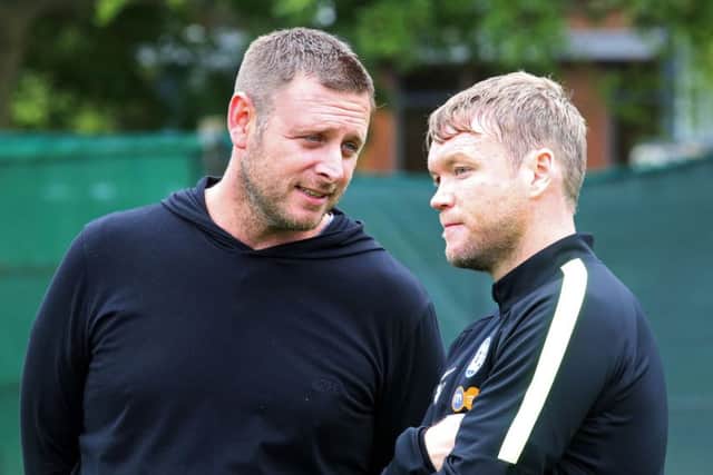 Posh chairman Darragh MacAnthony (left) with manager Grant McCann.