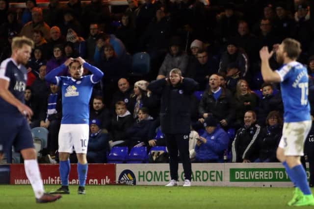 Posh manager Grant McCann (centre) can't believe what he's watching against Southend.