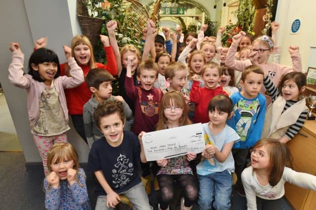 Pupils from Old Fletton Primary School who presented over £540 to Nene Park Trust following vandalism. The whole school took part in a non-uniform day to raise the cash EMN-170218-170419009