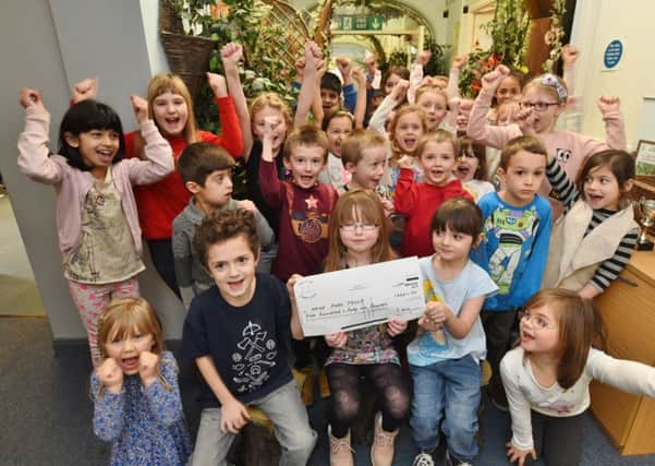 Pupils from Old Fletton Primary School who presented over Â£540 to Nene Park Trust following vandalism. The whole school took part in a non-uniform day to raise the cash EMN-170218-170419009
