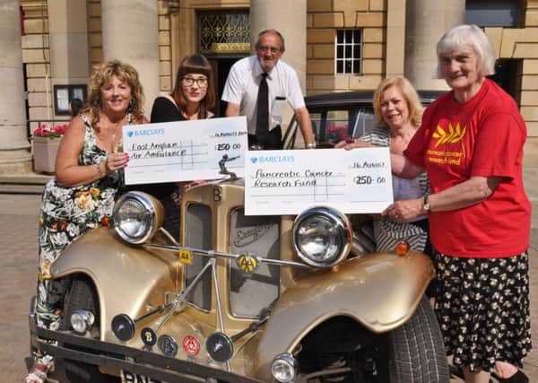 Peterborough classic and vintage cars event organisers Paula Thacker and Ray Dobbs with Coun Janet Goodwin presenting cheques to Leanne Tyers from EAAA and Doreen Dare from Pancreatic Cancer Research EMN-160817-003314009