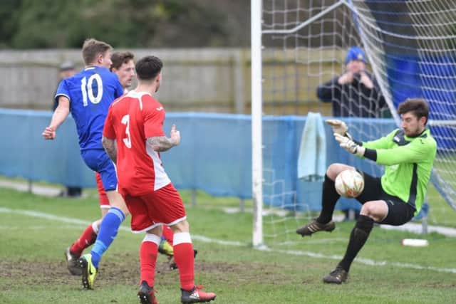 Peterborough Sports striker Mark Jones (10) can't quite force the ball past the Desborough 'keeper in the United Counties Premier Division clash at PSL. Photo: David Lowndes.