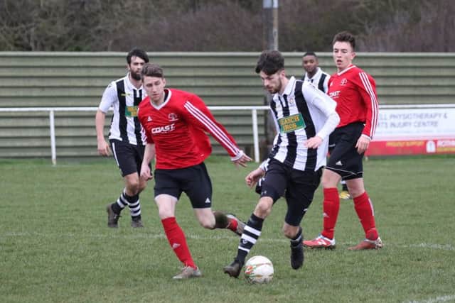 Matt Cox (stripes|) in action for Peterborough Northern Star at Rothwell. Photo: Tim Gates.