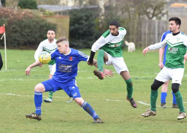 Action from FC Peterborough's 4-2 win against Brotherhood Sports (green) at Fulbridge Road. Photo: David Lowndes.