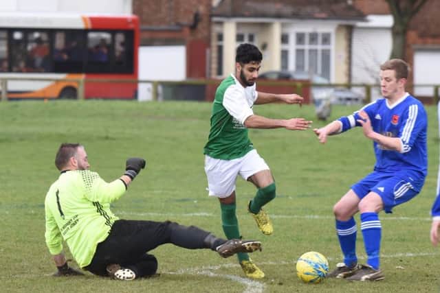 FC Peterborough (green) beat Brotherhood Sports 4-2 in a PFA Junior Cup tie. Photo: David Lowndes.