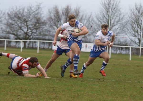 Will Carrington scores the first of Lions' 10 tries against Wellingborough. Picture: Mick Sutterby