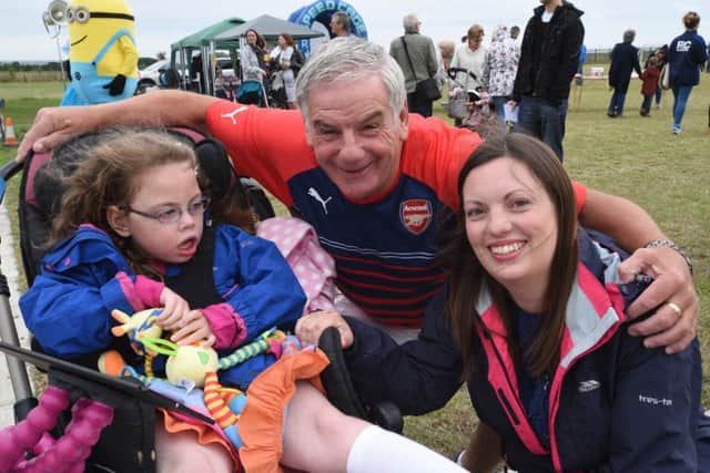 Whittlesey charity soccer event in aid of  Effie Hadman. She is pictured with mum Carly and Posh legend Jack Carmichael EMN-150726-150816009