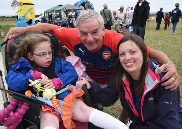 Whittlesey charity soccer event in aid of  Effie Hadman. She is pictured with mum Carly and Posh legend Jack Carmichael EMN-150726-150816009