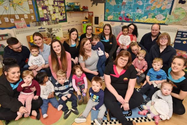 Staff, parents and children at the Rise and Shine Day Nursery, Ledbury Road which is due to close. EMN-170221-180837009