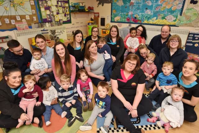 Staff, parents and children at the Rise and Shine Day Nursery, Ledbury Road which is due to close. EMN-170221-180837009