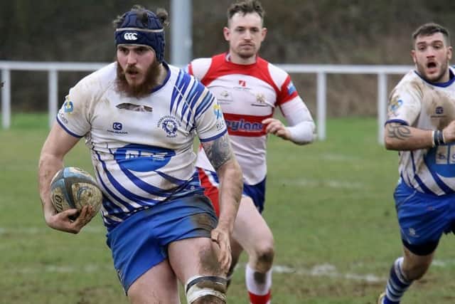 Conor Crown charges in for a try against Wellingborough. Picture: Mick Sutterby