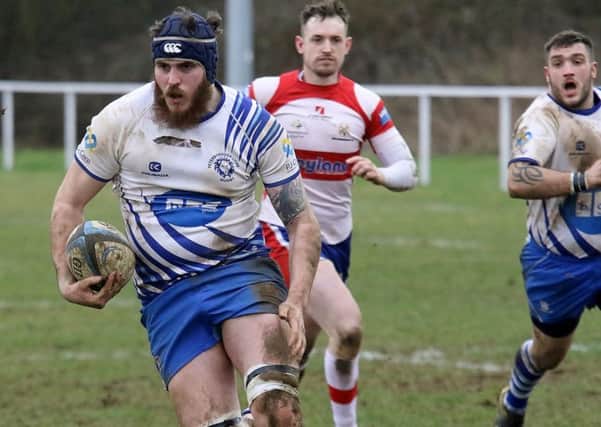 Conor Crown charges in for a try against Wellingborough. Picture: Mick Sutterby