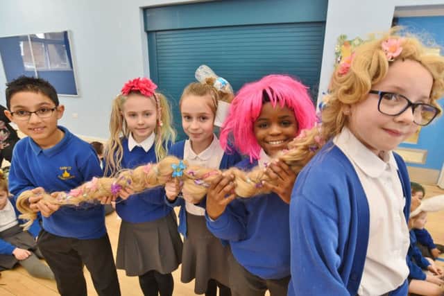 Castor Primary School pupils Poppy Evans with her year six classmates before her charity head shave EMN-170218-170725009
