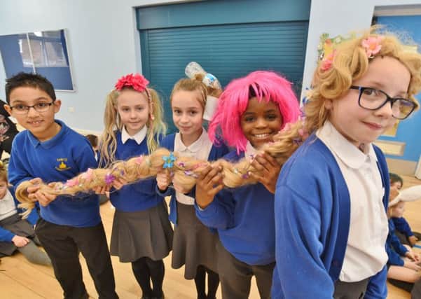Castor Primary School pupils Poppy Evans with her year six classmates before her charity head shave EMN-170218-170725009