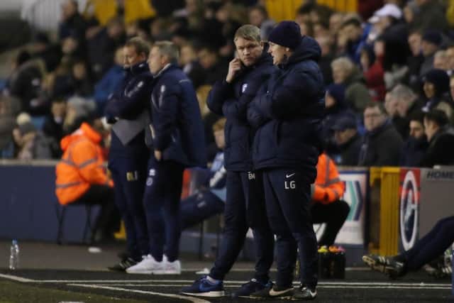 Posh boss Grant MCCann is deep in discussion with assistant boss Lee Glover during the 1-0 defeat at Millwall. Photo: Joe Dent/theposh.com.