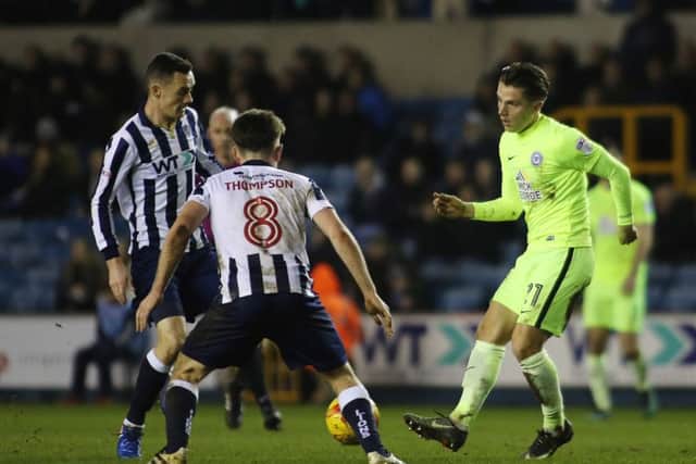 Posh striker Tom Nichols has been asked to learn from Billy Sharp and Lee Gregory.