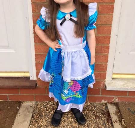 Stacie Dunn sent us this photo of  her  4 year old daughter EsmÃ© dressed at Alice in Wonderland