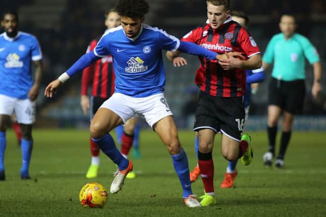 Posh striker Lee Angol could move on loan to a National League club.