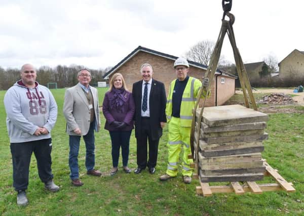 Orton Park Cricket Club  with its new extension. Arrival of the paving slabs from Lower Bridge Street. Pictured are  club chairman Mark Durham, Councillors Peter Hiller, June Bull and Graham Casey with  David  Edevane from Skanska EMN-170227-191920009