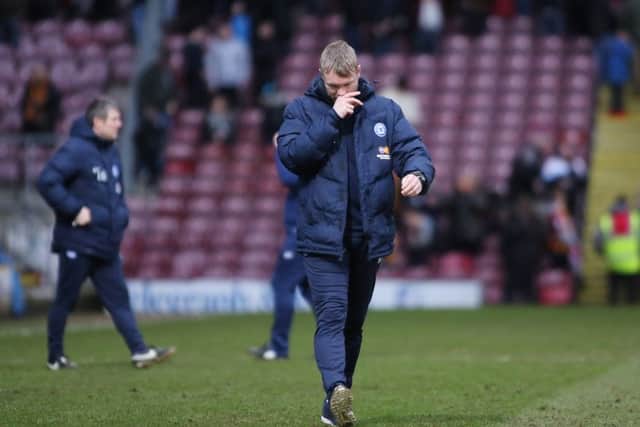 Posh manager Grant McCann deep in thought after the final whistle at Bradford City.