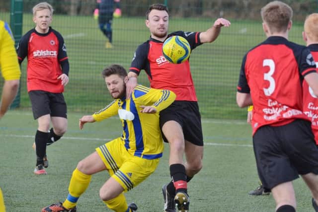 Action from Netherton United's 3-2 win over Moulton Harrox (yellow) in the President's Shield semi-final. Photo: David Lowndes.