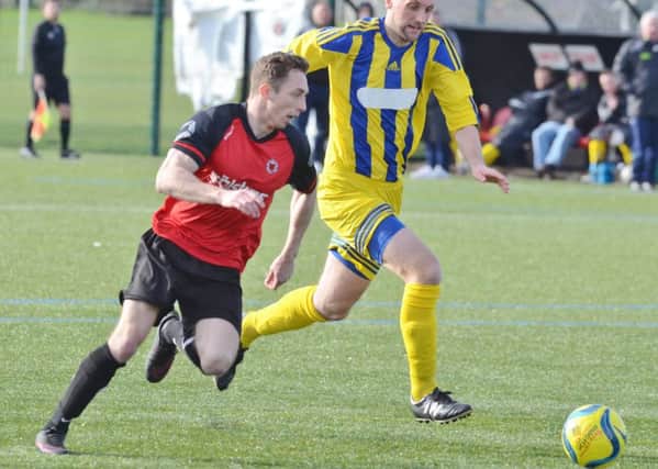 Two-goal Tom Randall in action for Netherton against Moulton Harrox. Photo: David Lowndes.