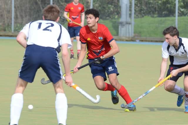 City of Peterborough man-of-the-match Nicky Reddy (red) in action against Dereham. Photo: David Lowndes.