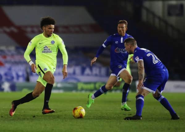 Lee Angol in action for Posh at Oldham.