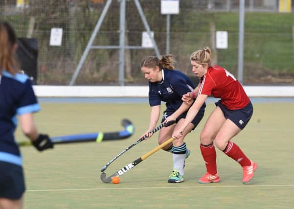 Anna Faux (red) was City of Peterborough Ladies' player-of-the-match at Alderley Edge.