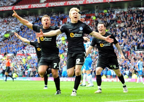 Criag Mackail-Smith celebrates his 99th Posh goal against Huddersfield in May, 2011.